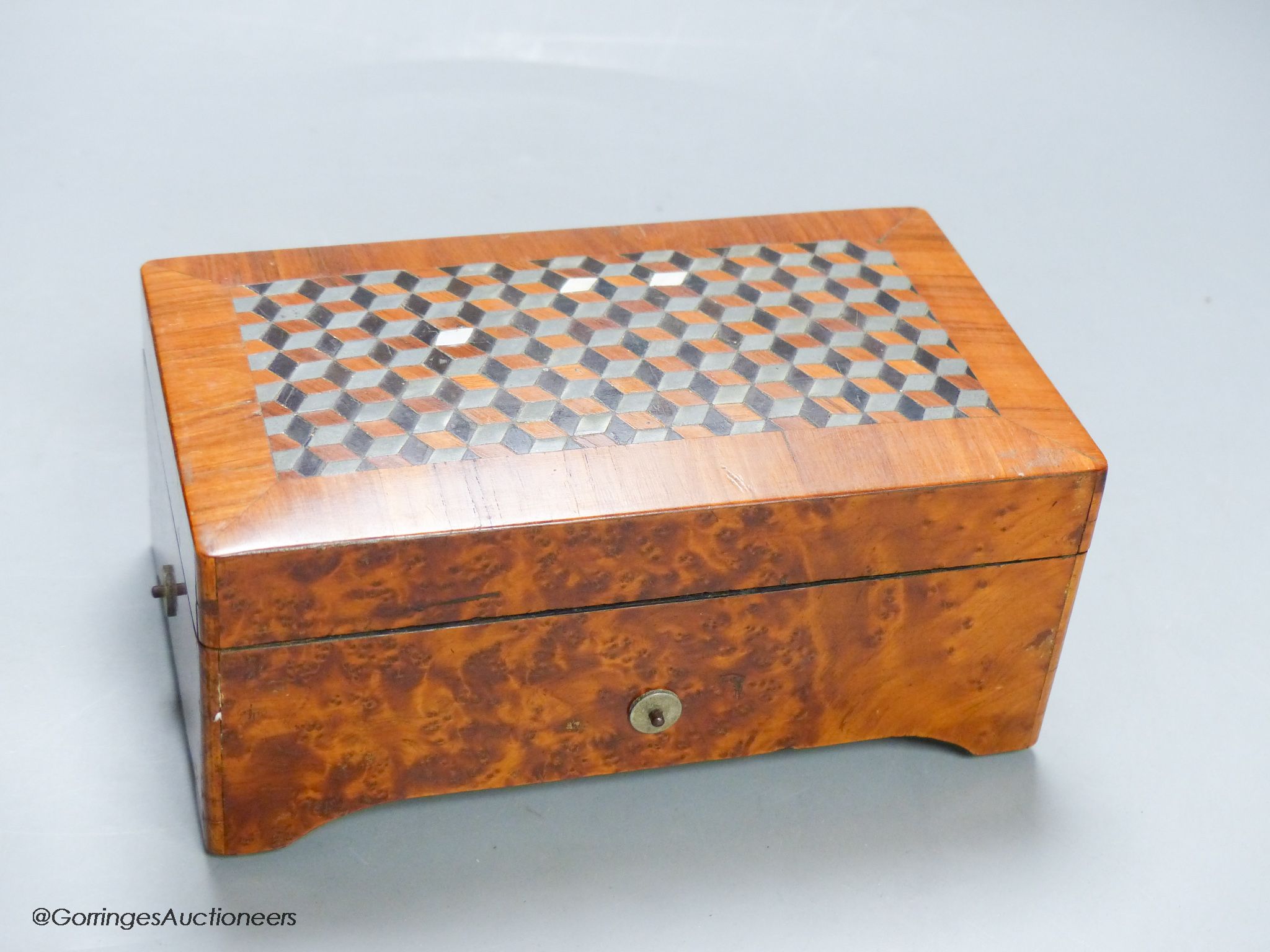 A small Swiss amboyna six air cylinder musical box